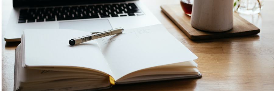 A book and pen on a table