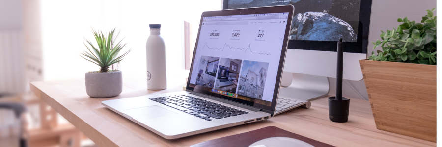 An open laptop on a tidy desk
